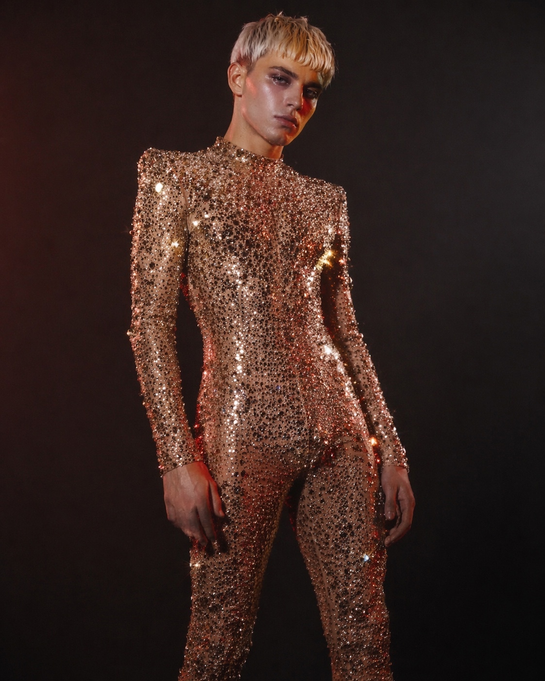 Charlie Void in a rose-gold crystal bodysuit