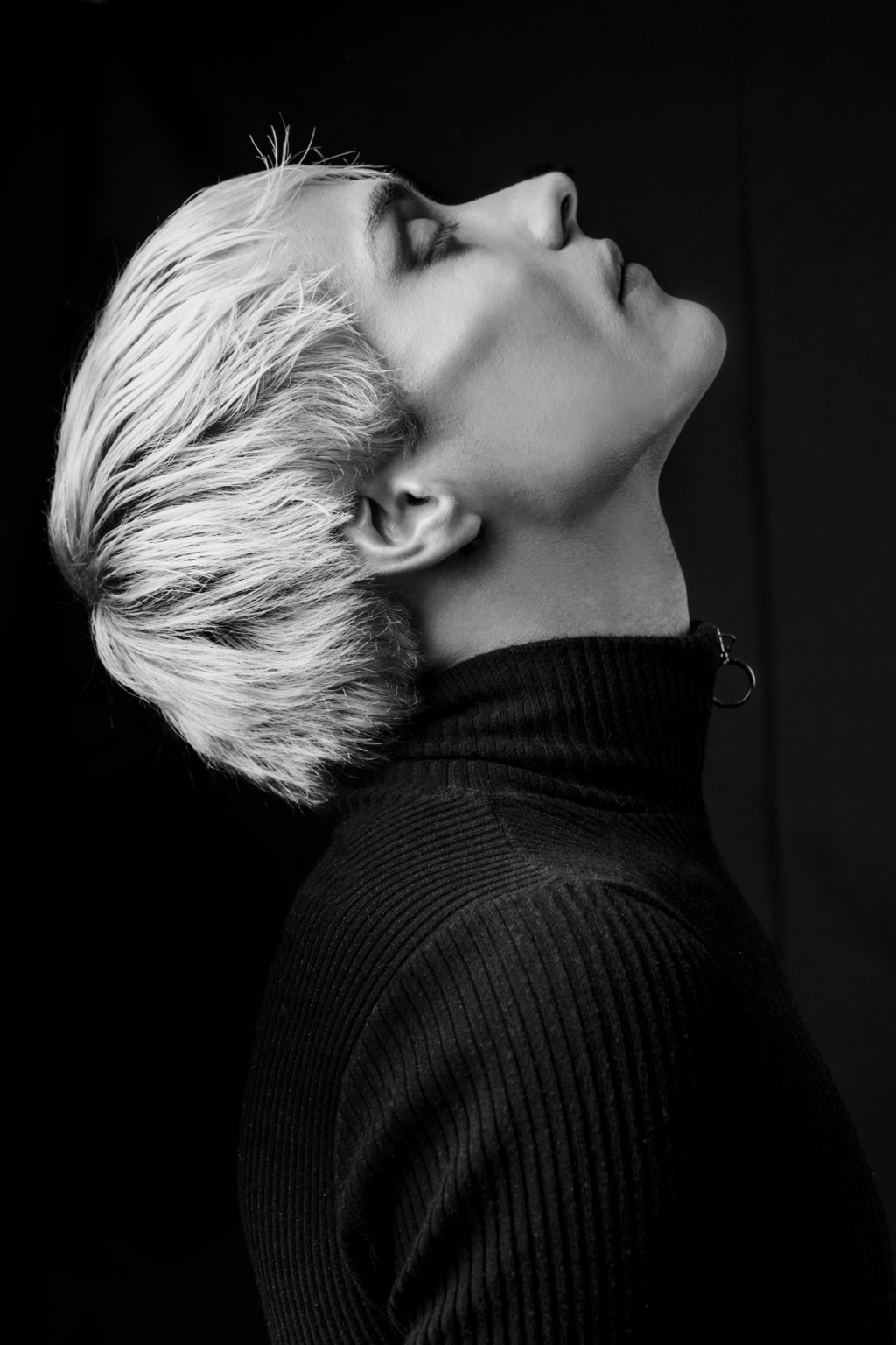 Black-and-white upward profile portrait of Charlie Void